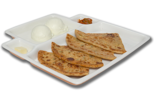 Indian paratha served with pickel and plain yogurt