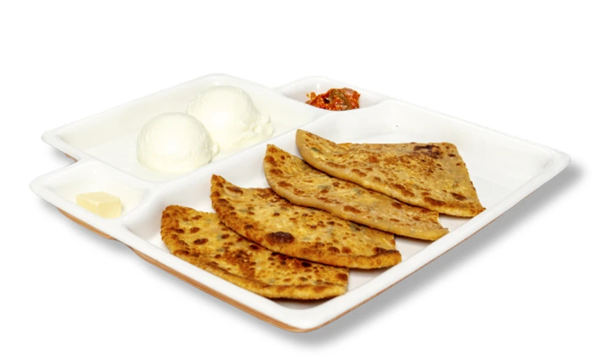 Neehee's Aloo Paratha meal platter, served with a side of curd and pickle.